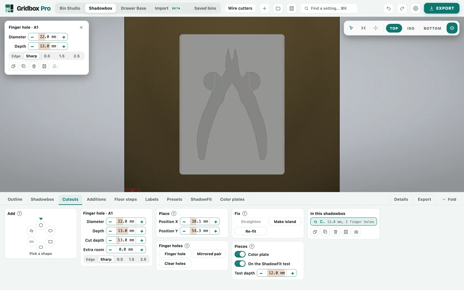 Gridbox Pro's Cutouts tab for the wire cutters shadowbox: finger hole size and place, Mirrored pair, the color plate and ShadowFit switches, and the list In this shadowbox showing one cutout with 2 finger holes